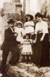 The Santini family at the Vesta temple, near the house. 1910. Little Pio in his fathers-arms.jpg